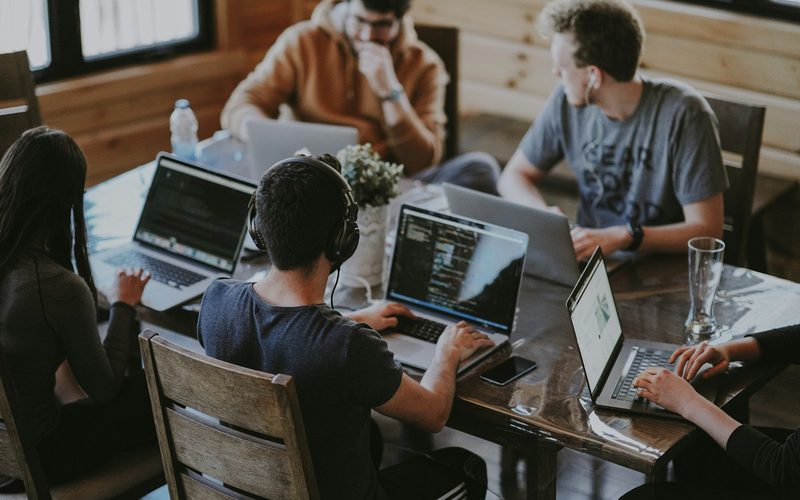 Young sales and marketing professionals collaborating in a bright modern office